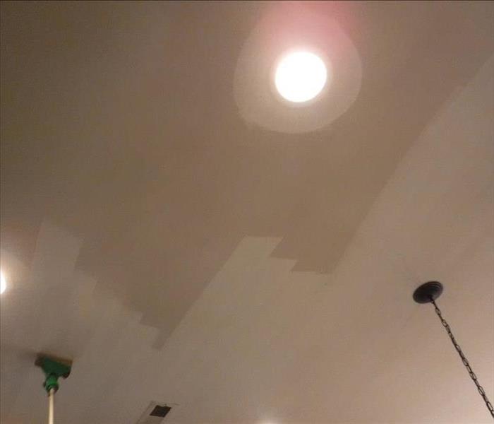 Ceiling in the process of being cleaned from fire & smoke damage by SERVPRO of Jackson
